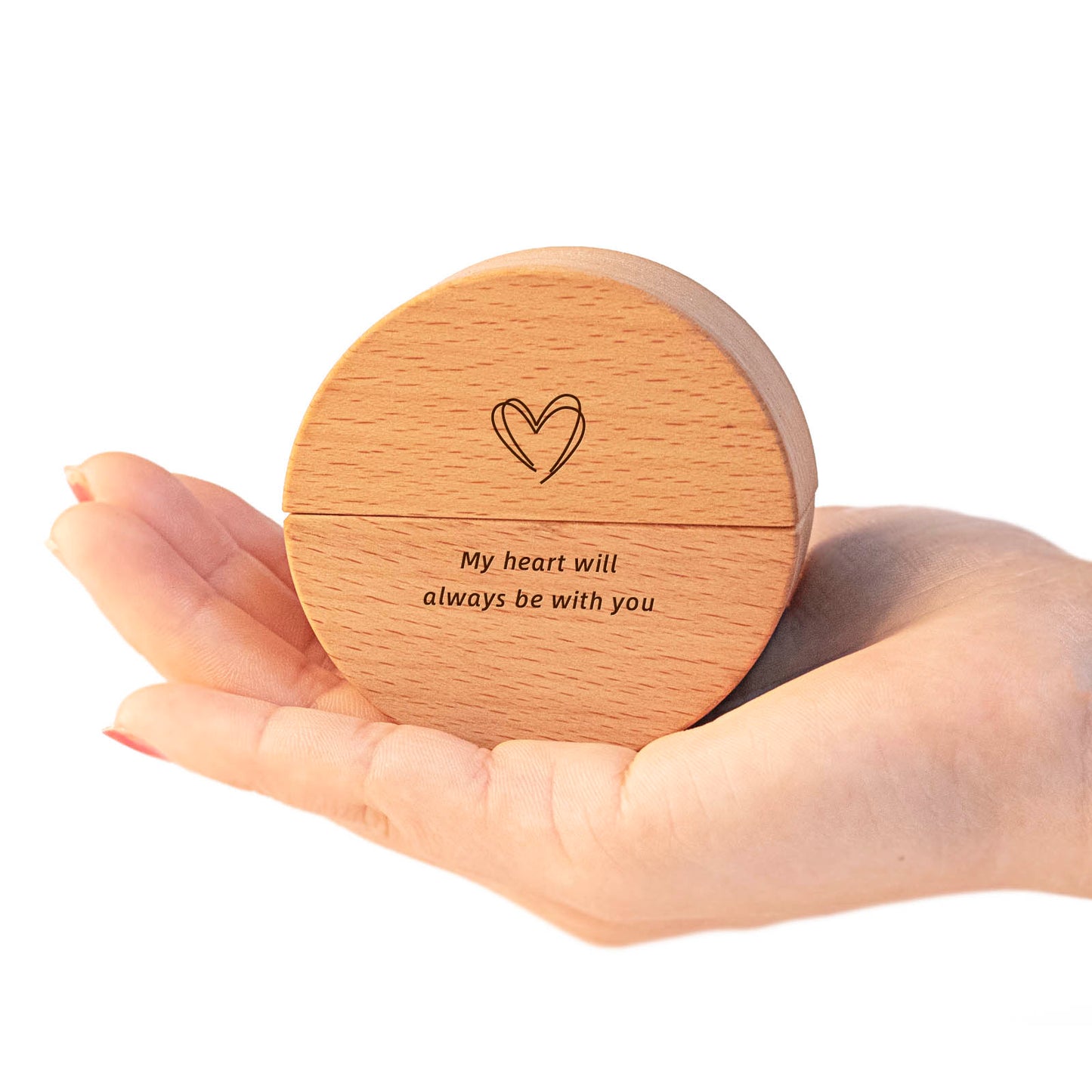 Custom engraved round wooden keepsake urn held in palm – laser etched heart and "My heart will always be with you", natural wood grain