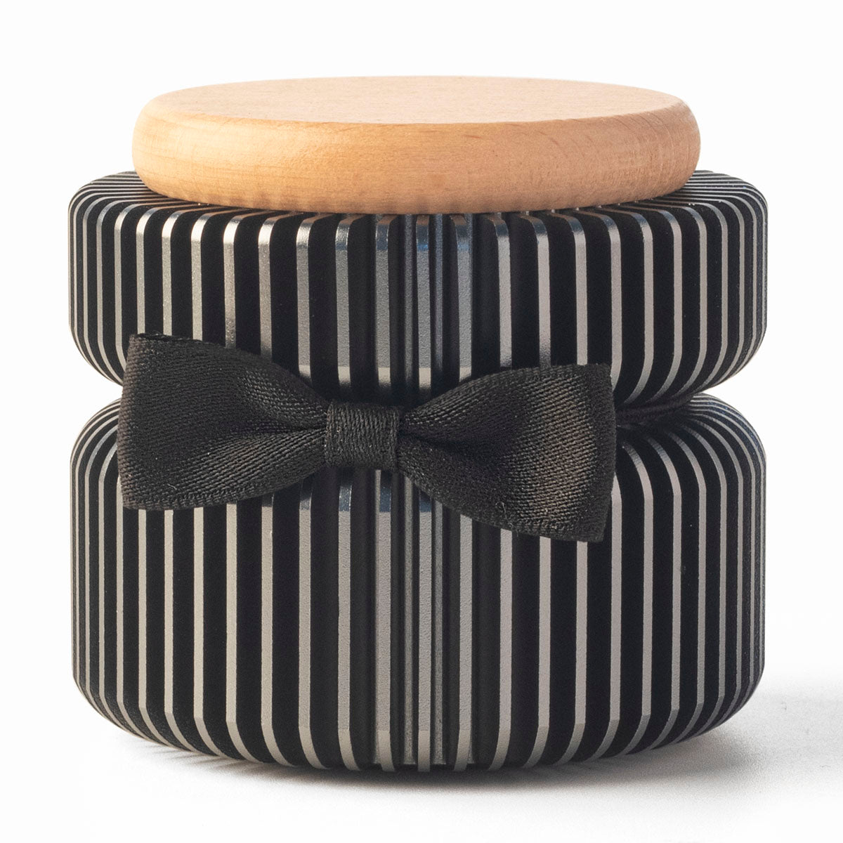 Dark gray keepsake urn front view – anodized aluminum with black and silver vertical stripes, black satin ribbon bow, natural beech wood lid
